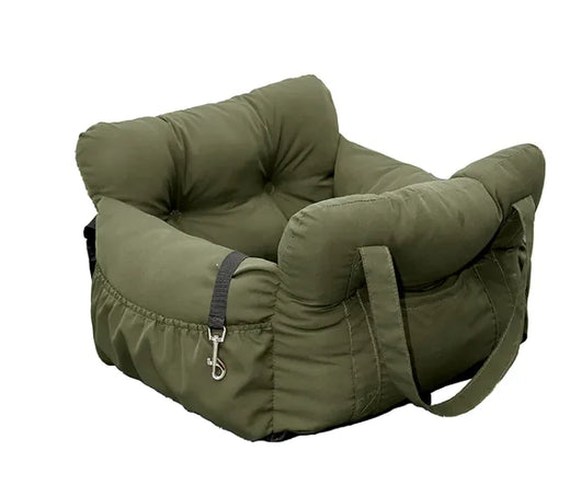 Small dog resting in the padded car seat interior