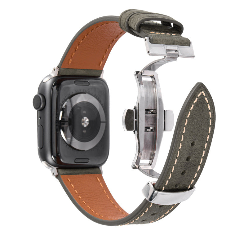 Smartwatch with a brown and green leather strap on a white background