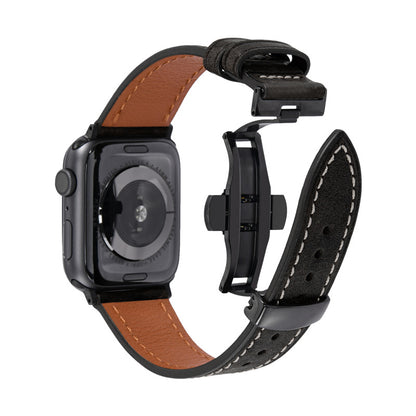 Smartwatch with a brown leather band and black metal case on a white background