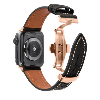 Black cowhide leather Apple Watch band with rose gold butterfly buckle on a white background