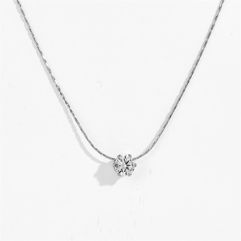 Silver-tone six claw pendant necklace with round clear stone pendant in a six-prong setting, displayed against a clean white background.