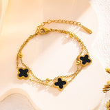 Close-up of the lobster clasp and adjustable extender on the black clover charm bracelet
