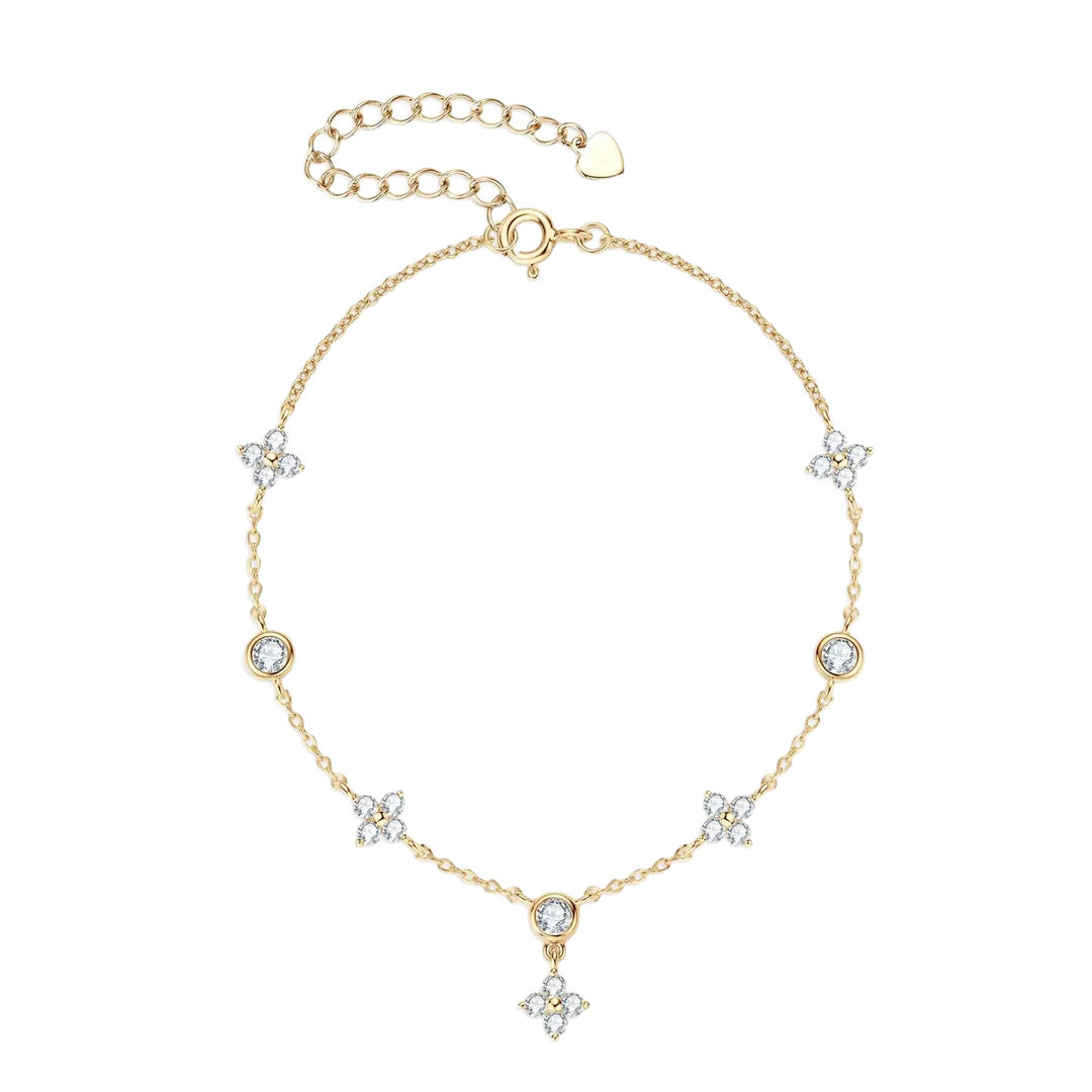 Gold four-leaf clover anklet chain with clear stone charms, dangling clover pendant, and extender clasp