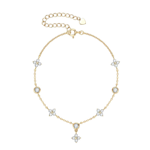 Gold four-leaf clover anklet chain with clear stone charms, dangling clover pendant, and extender clasp