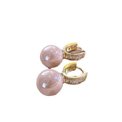 Simple Light Luxury Ear Buckle pink pearl earrings with gold crystal pave hoops on white background