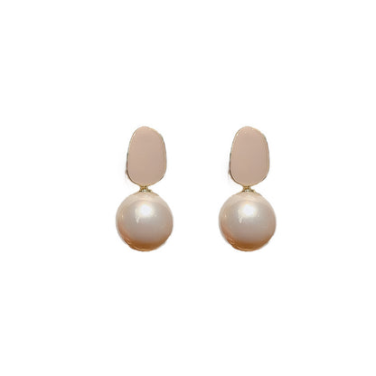Pink pearl drop stud earrings product photo on white background
