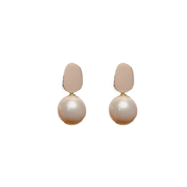 Pink pearl drop stud earrings product photo on white background