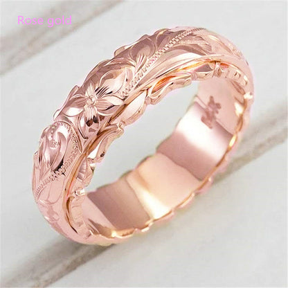 Rose flower carved ring band in rose gold finish, close-up view