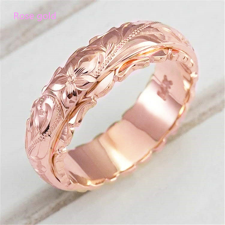Rose flower carved ring band in rose gold finish, close-up view