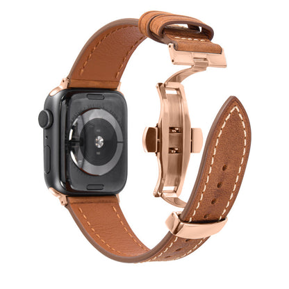 Smartwatch with a brown leather strap and rose gold metal clasp on a white background