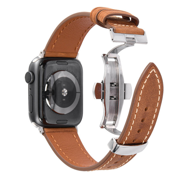 Smartwatch with a brown leather strap on a white background