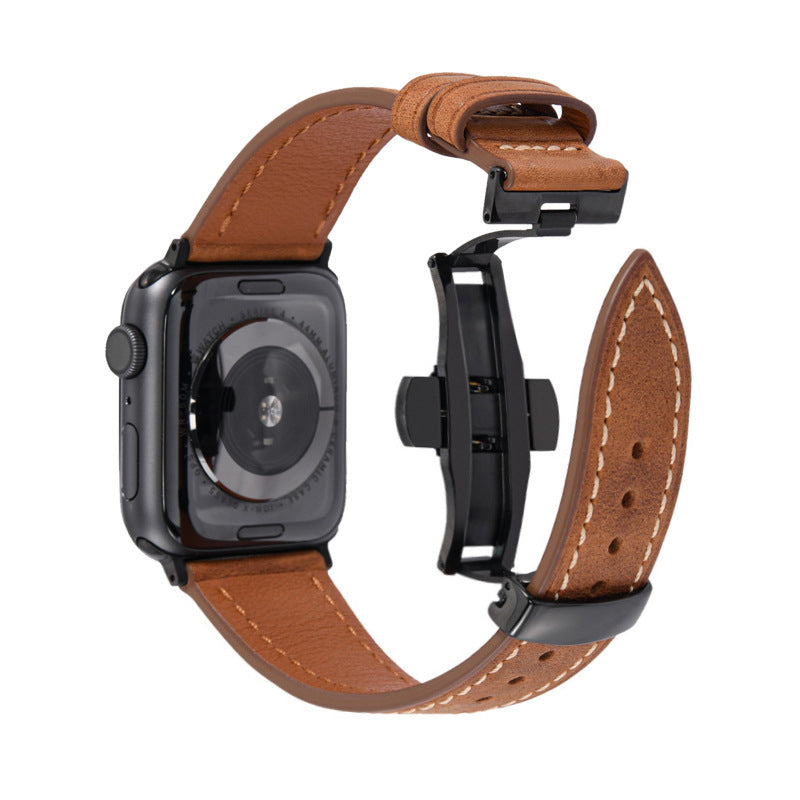A brown leather watch band with white stitching and black hardware, shown attached to a smartwatch on a plain white background.