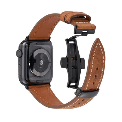 A brown leather watch band with white stitching and black hardware, shown attached to a smartwatch on a plain white background.