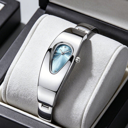 Silver stainless steel water drop watch with blue teardrop dial, front view on jewelry cushion
