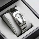 Silver and white water drop watch on jewelry display stand, side angle