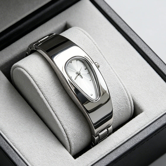 Silver and white water drop watch on jewelry display stand, side angle