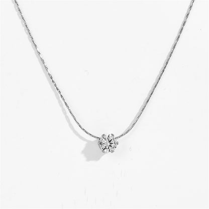 Silver-tone six claw pendant necklace with clear stone pendant, close-up view