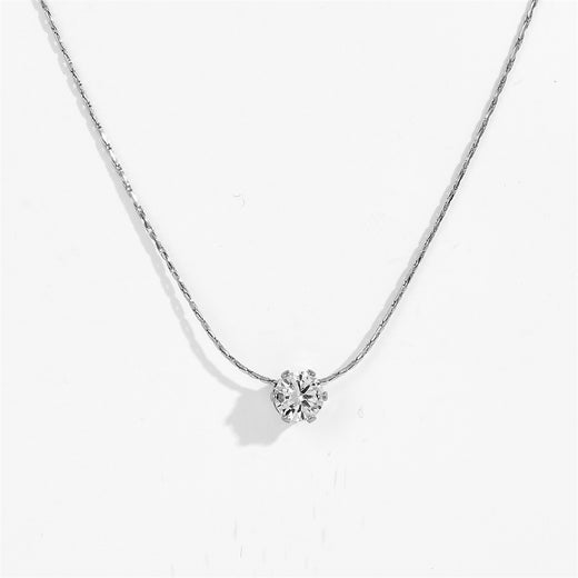 Silver-tone six claw pendant necklace with clear stone pendant, close-up view