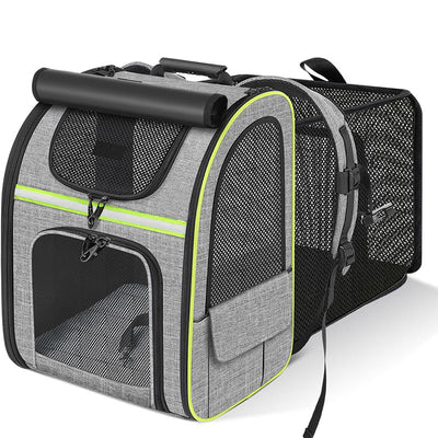 Grey expandable pet carrier backpack with green trim and mesh ventilation panels