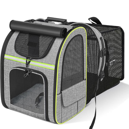 Grey expandable pet carrier backpack with green trim and mesh ventilation panels