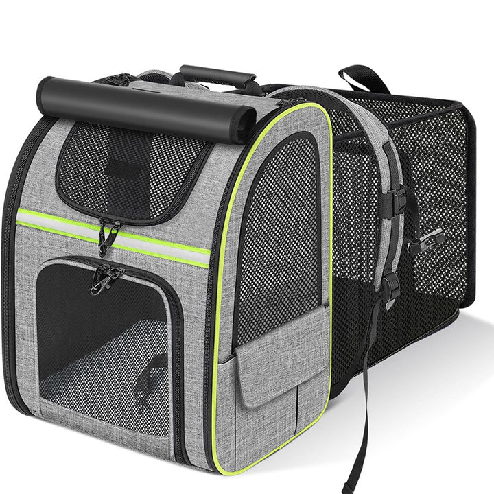 Grey expandable pet carrier backpack with green trim and mesh ventilation panels