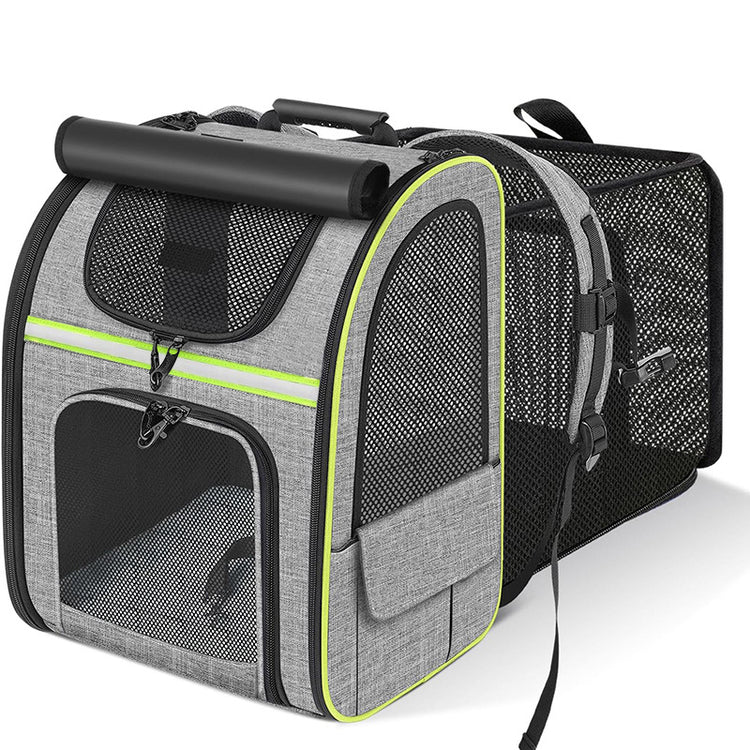 Grey expandable pet carrier backpack with green trim and mesh ventilation panels