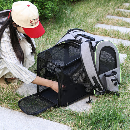 Person opening the expanded back panel of the pet carrier backpack outdoors