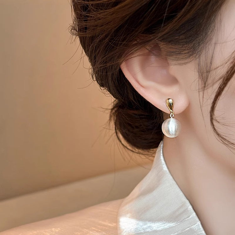 Frosted brushed ball stud earrings, pair shown together