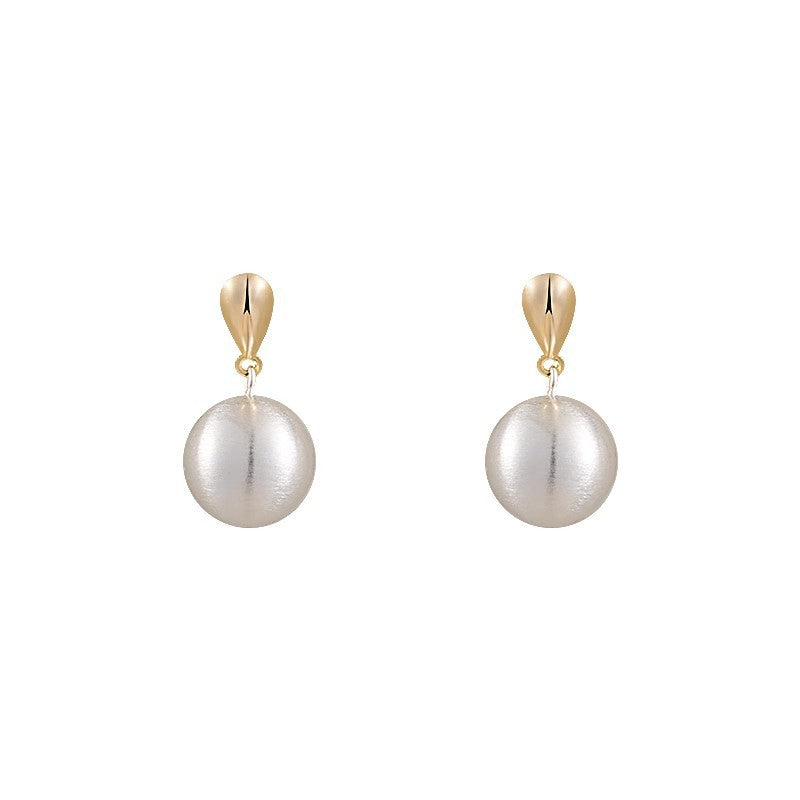 Frosted brushed ball stud earrings, detail of the gold-tone post