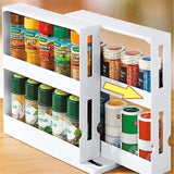 White 2-tier rotating spice rack loaded with spice jars on a counter