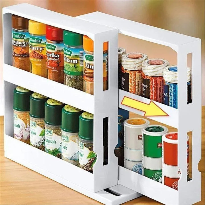 White 2-tier rotating spice rack loaded with spice jars on a counter