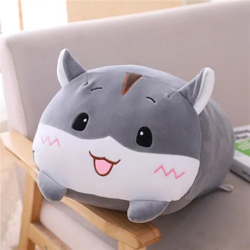 Plush animal being held to show its size relative to a hand