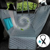 Grey diamond-quilted rear car seat cover with a center mesh window and teal side storage pockets for pet travel